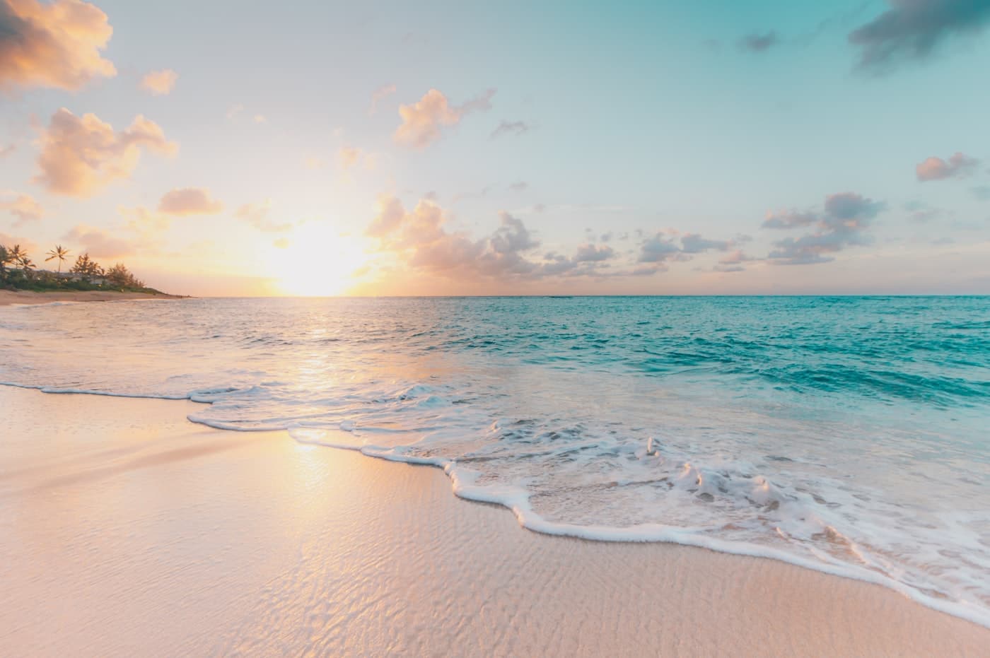 A calm ocean coastline at golden hour