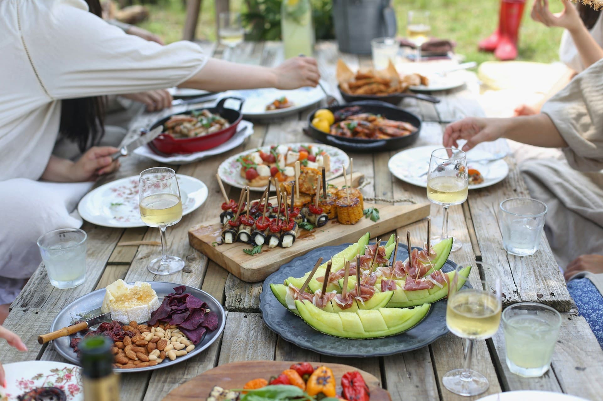 A long table set for a private group dinner among the Napa vineyards