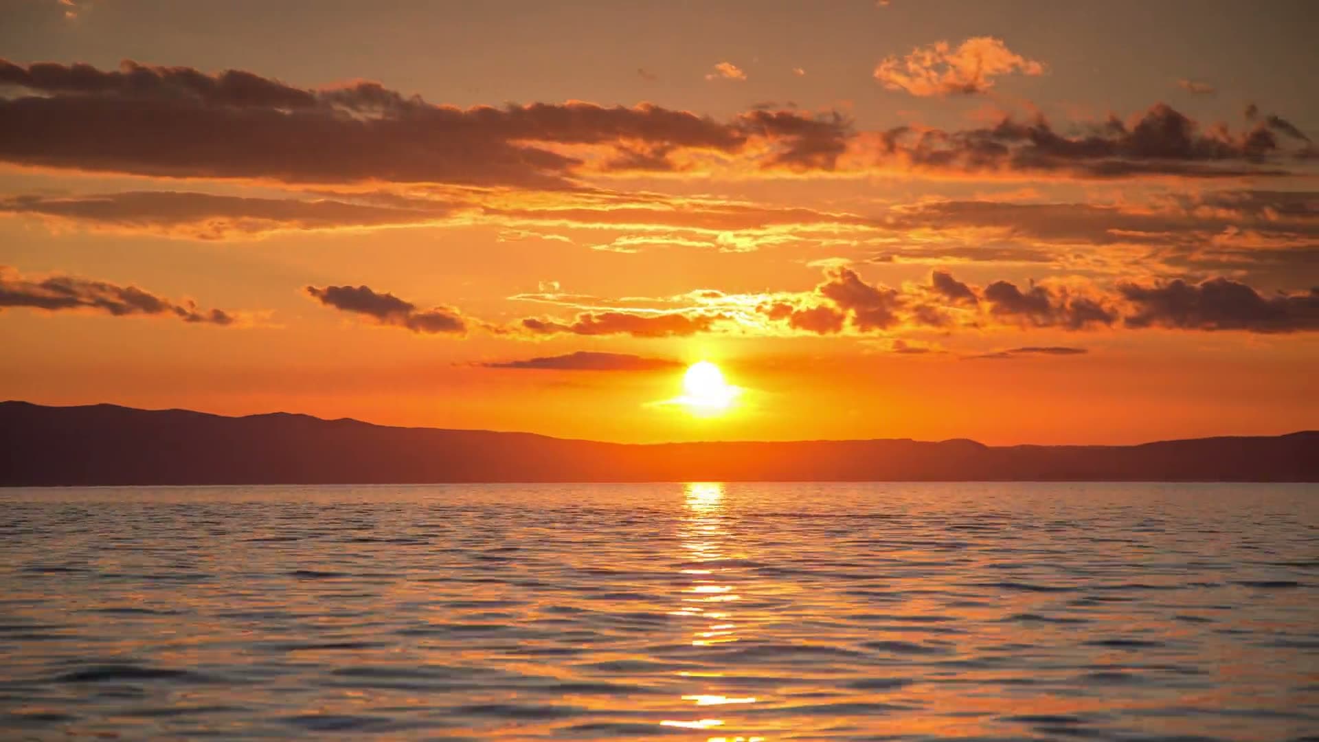 Golden sunset light shimmering on the sea