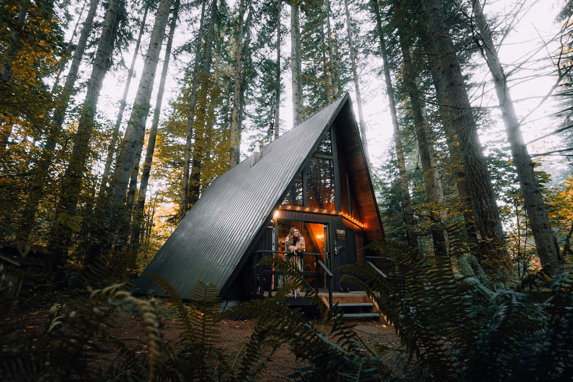 A couple at a luxury Aspen Mountain resort with the Elk Mountains beyond