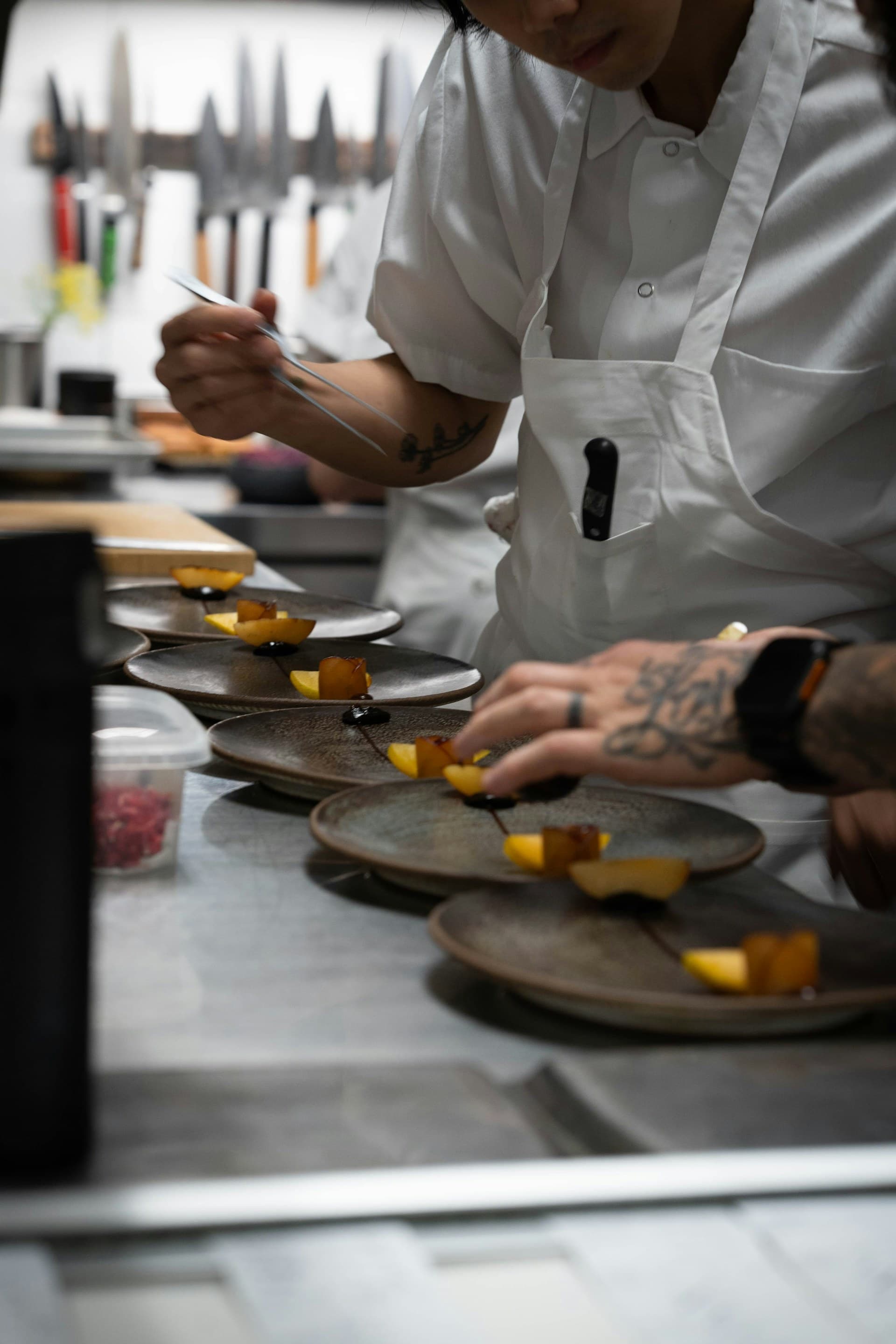 A chef plating a Southwest dish with red-rock views